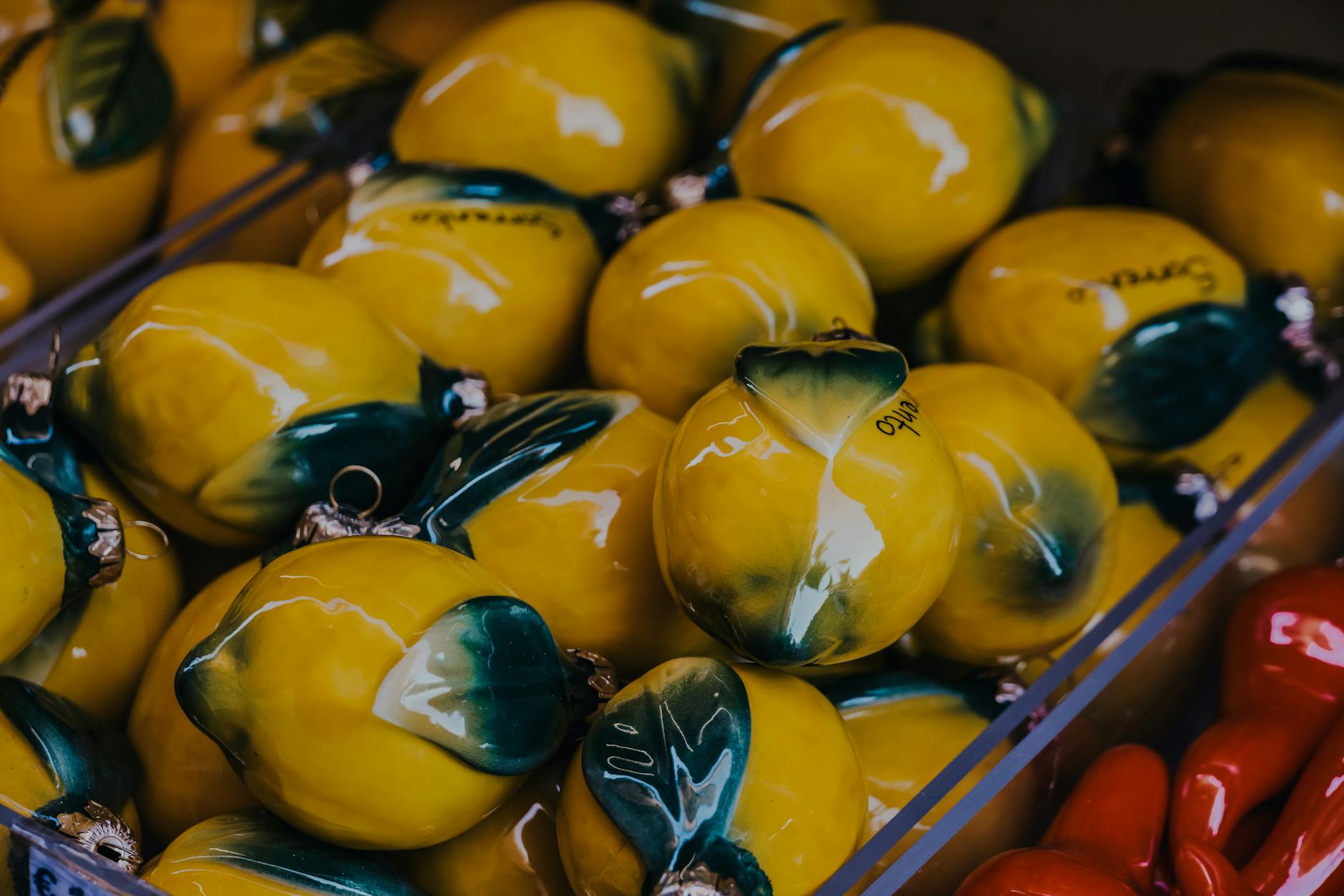 Bright yellow ceramic lemons artfully arranged, symbolizing fresh communication and playful approach to intimacy